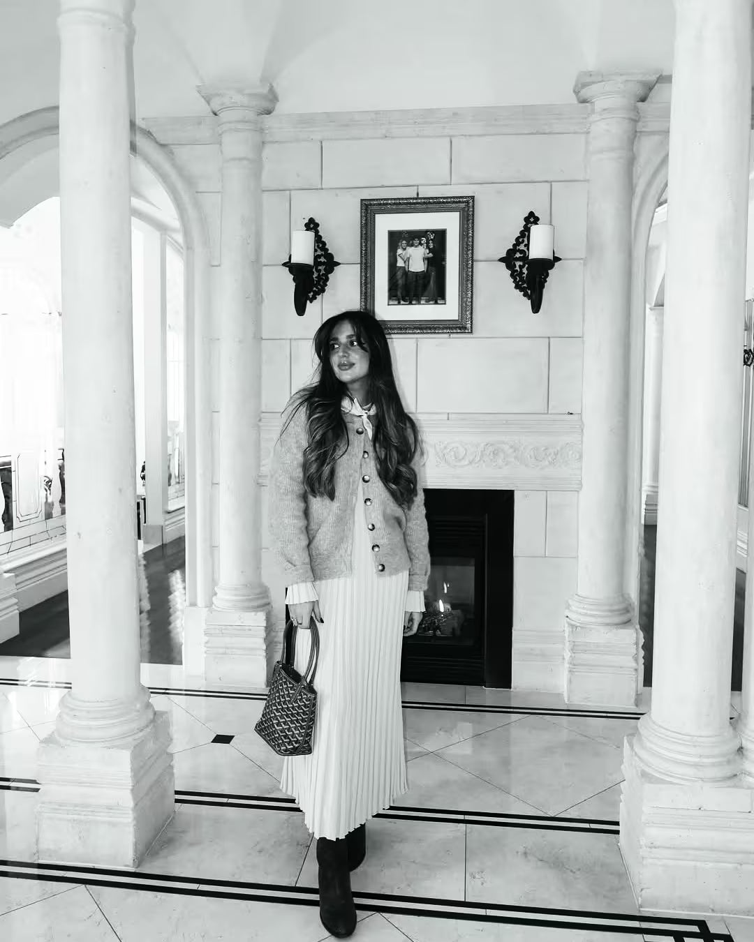 Black-and-white portrait of home cook Chiara Plastina in a grand marble interior with classical columns